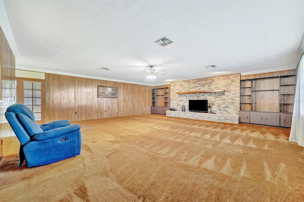 7015 Spears Road Plant City, FL 33567 - Photo 32 of 77 a room with furniture and a fireplace