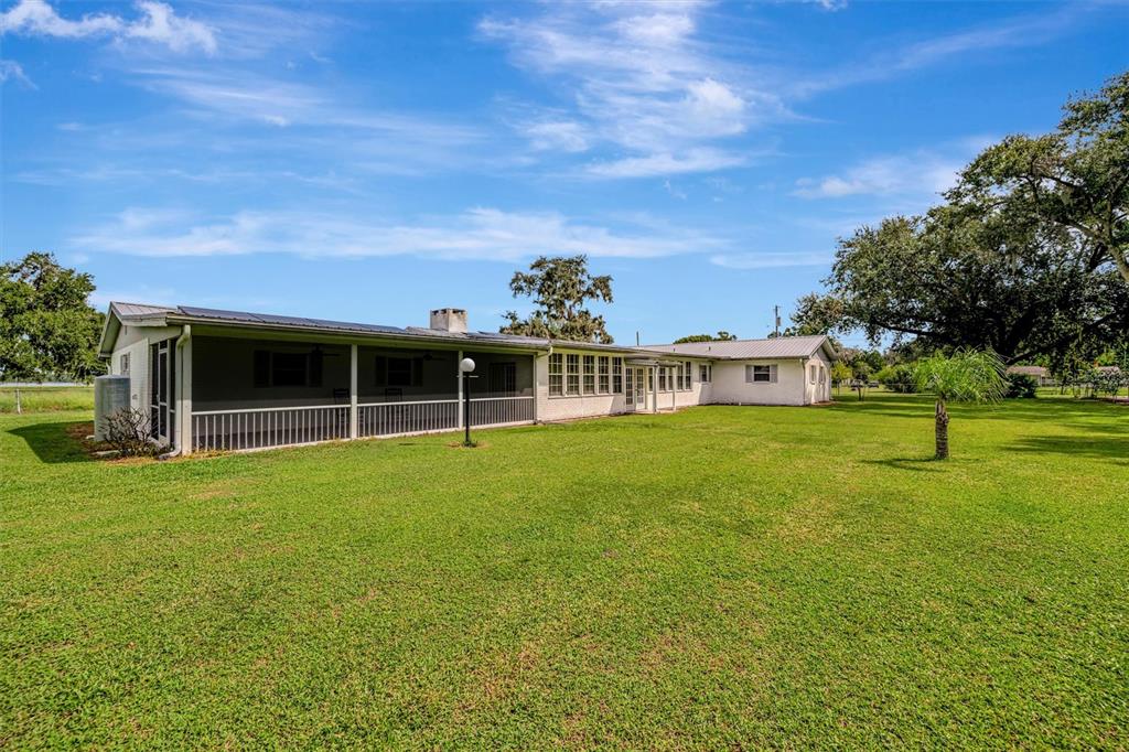 7015 Spears Road Plant City, FL 33567 - Photo 42 of 77 a front view of a house with a garden