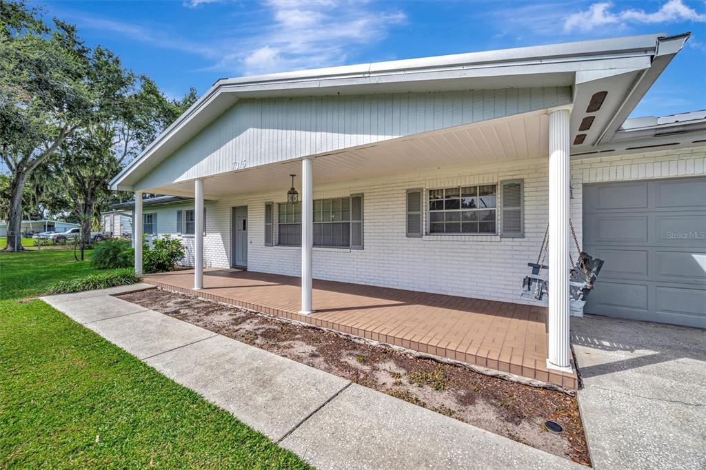 7015 Spears Road Plant City, FL 33567 - Photo 46 of 77 a front view of a house with a yard