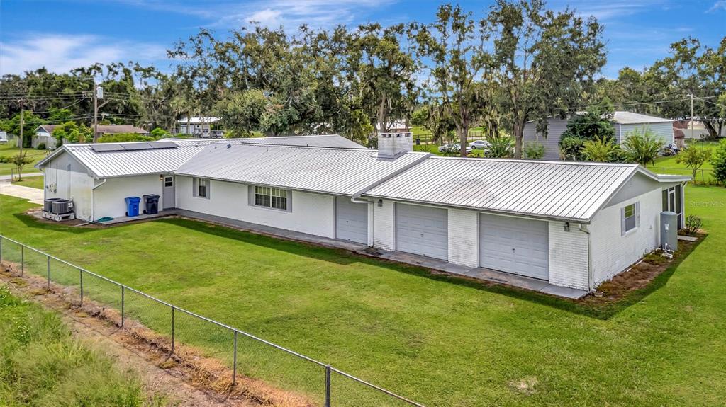 7015 Spears Road Plant City, FL 33567 - Photo 50 of 77 a aerial view of a house with table and chairs under an umbrella