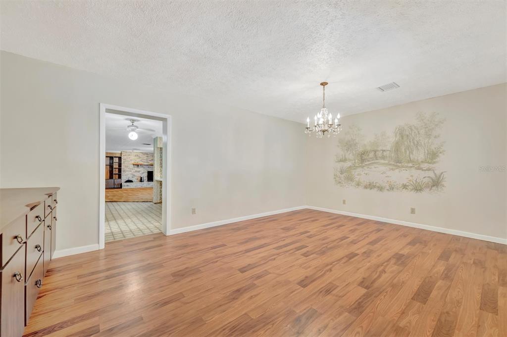 7015 Spears Road Plant City, FL 33567 - Photo 6 of 77 wooden floor in an empty room with a window