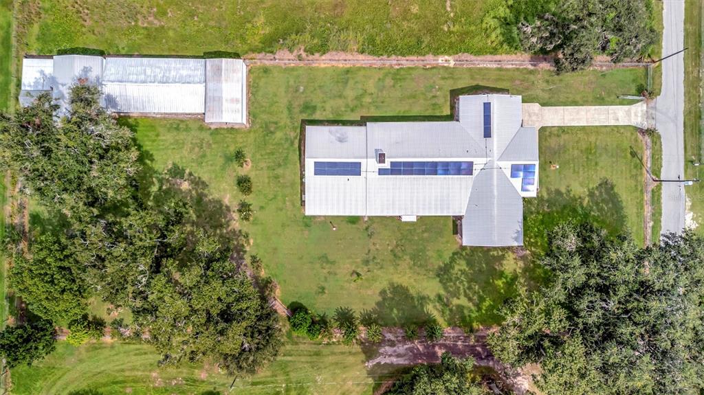 7015 Spears Road Plant City, FL 33567 - Photo 61 of 77 an aerial view of a house with a yard and lake view