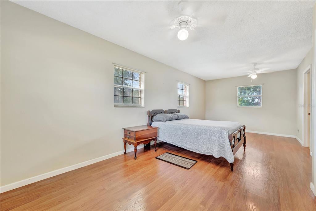 7015 Spears Road Plant City, FL 33567 - Photo 8 of 77 a living room with furniture and a wooden floor