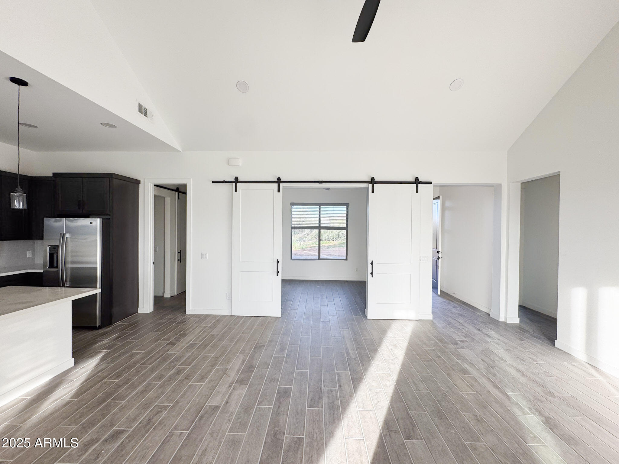 16143 East Lowden Court Scottsdale, AZ 85262 - Photo 11 of 20 a view of a kitchen with a sink and a refrigerator