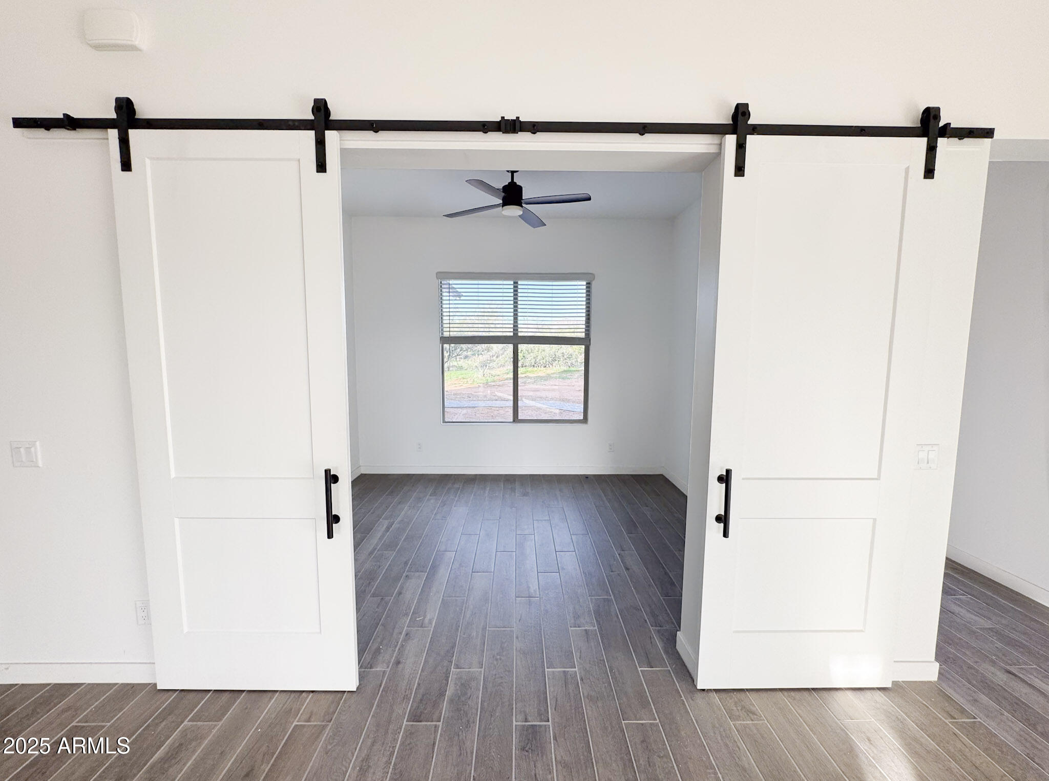 16143 East Lowden Court Scottsdale, AZ 85262 - Photo 12 of 20 a view of a hallway with a window and wooden floor