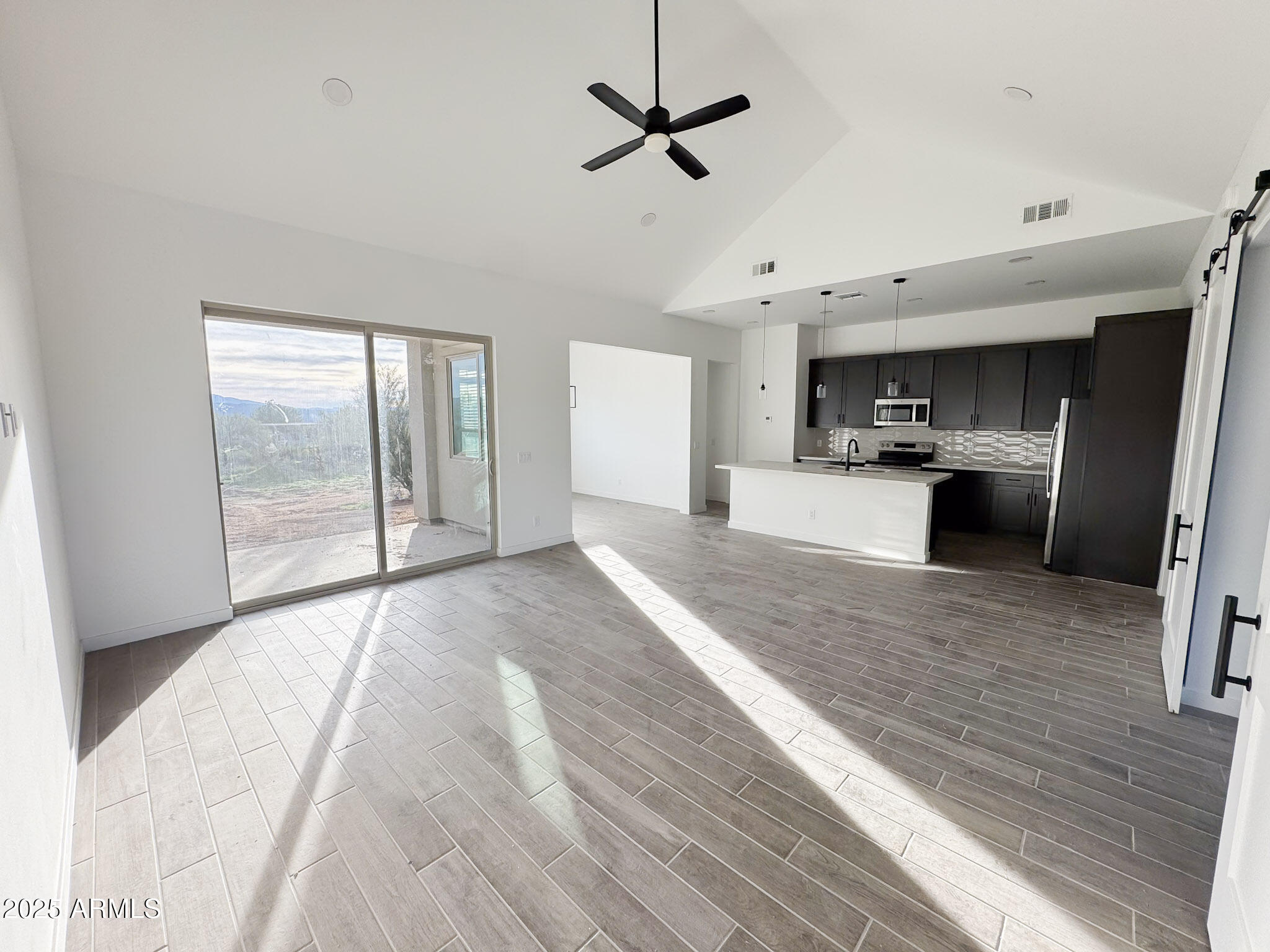 16143 East Lowden Court Scottsdale, AZ 85262 - Photo 3 of 20 a view of a kitchen with a sink and wooden floor