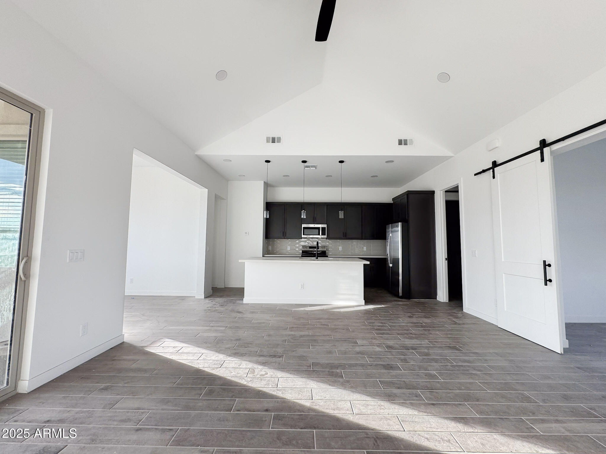 16143 East Lowden Court Scottsdale, AZ 85262 - Photo 4 of 20 a view of a kitchen with a sink and a refrigerator