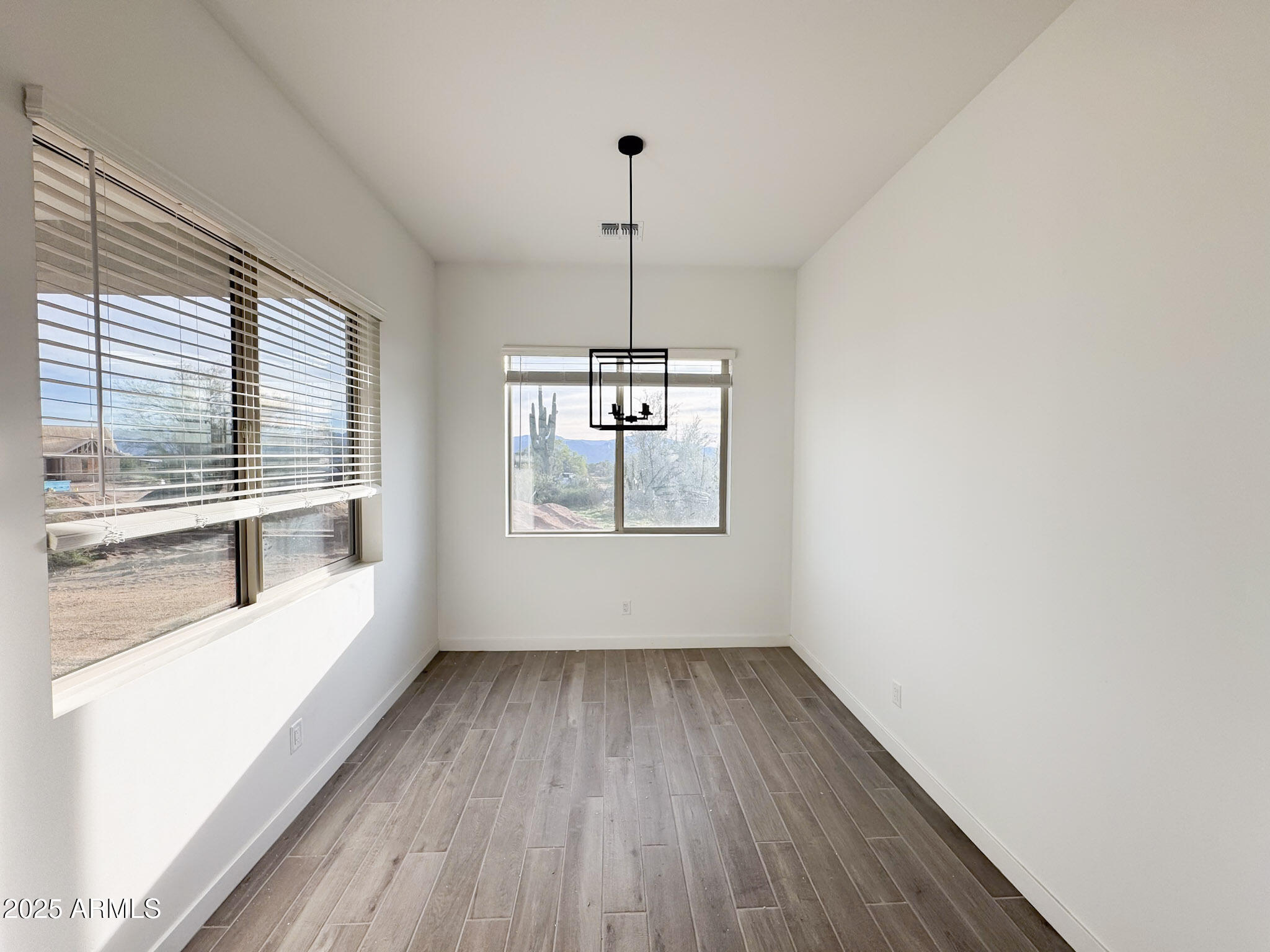 16143 East Lowden Court Scottsdale, AZ 85262 - Photo 6 of 20 a view of a room with wooden floor and a window