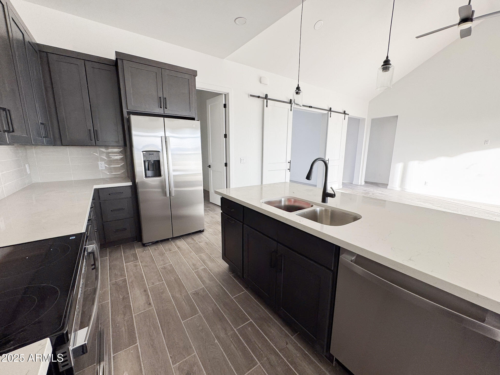16143 East Lowden Court Scottsdale, AZ 85262 - Photo 8 of 20 a kitchen with kitchen island granite countertop a sink and refrigerator