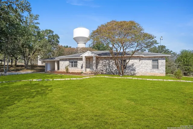 a front view of house with yard and seating area