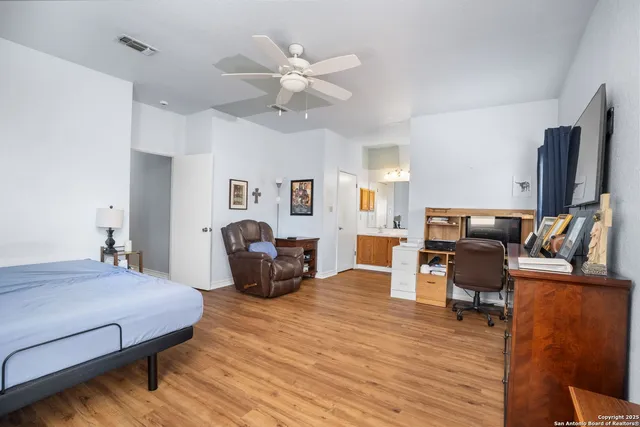 a bed room with furniture and a chandelier