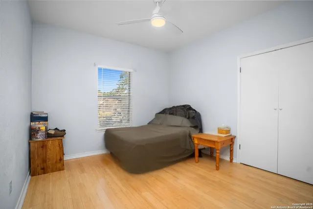 a living room with furniture and a piano