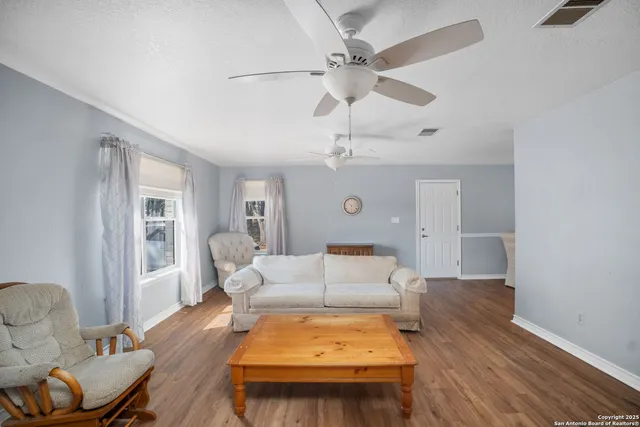 a living room with furniture and a table