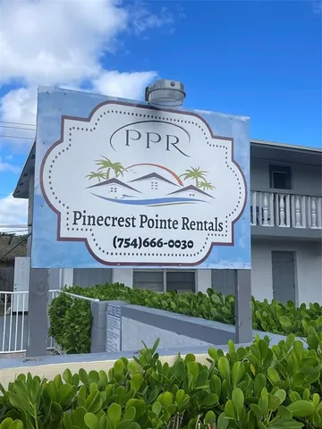 a view of a house with a tub and a garden