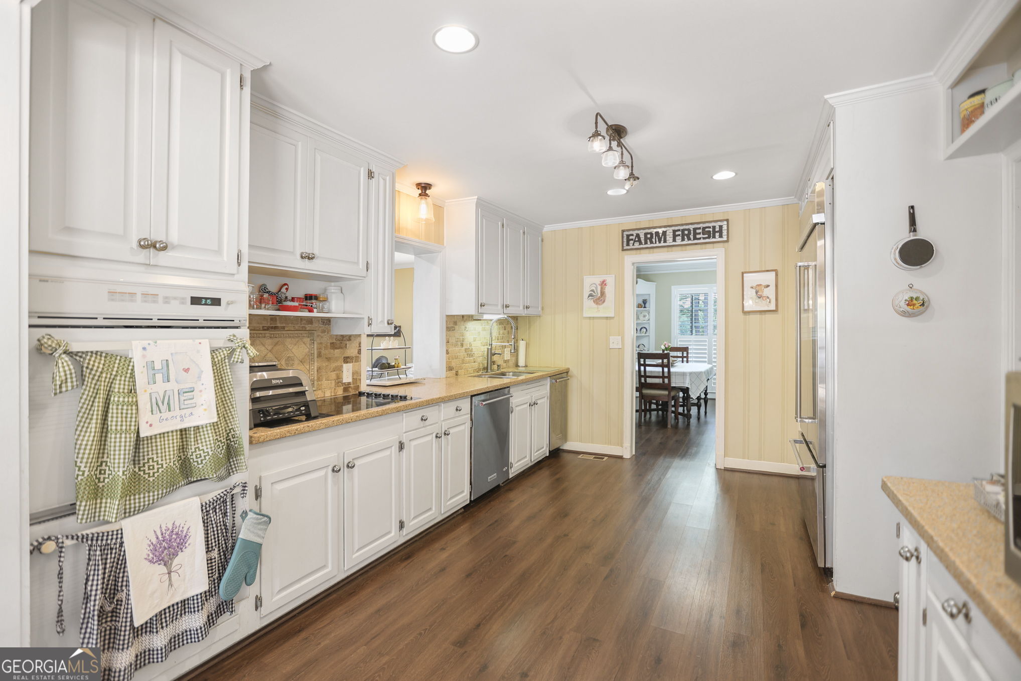 420 Ridgecrest Road LaGrange, GA 30240 - Photo 16 of 48 a kitchen with stainless steel appliances sink refrigerator and cabinets