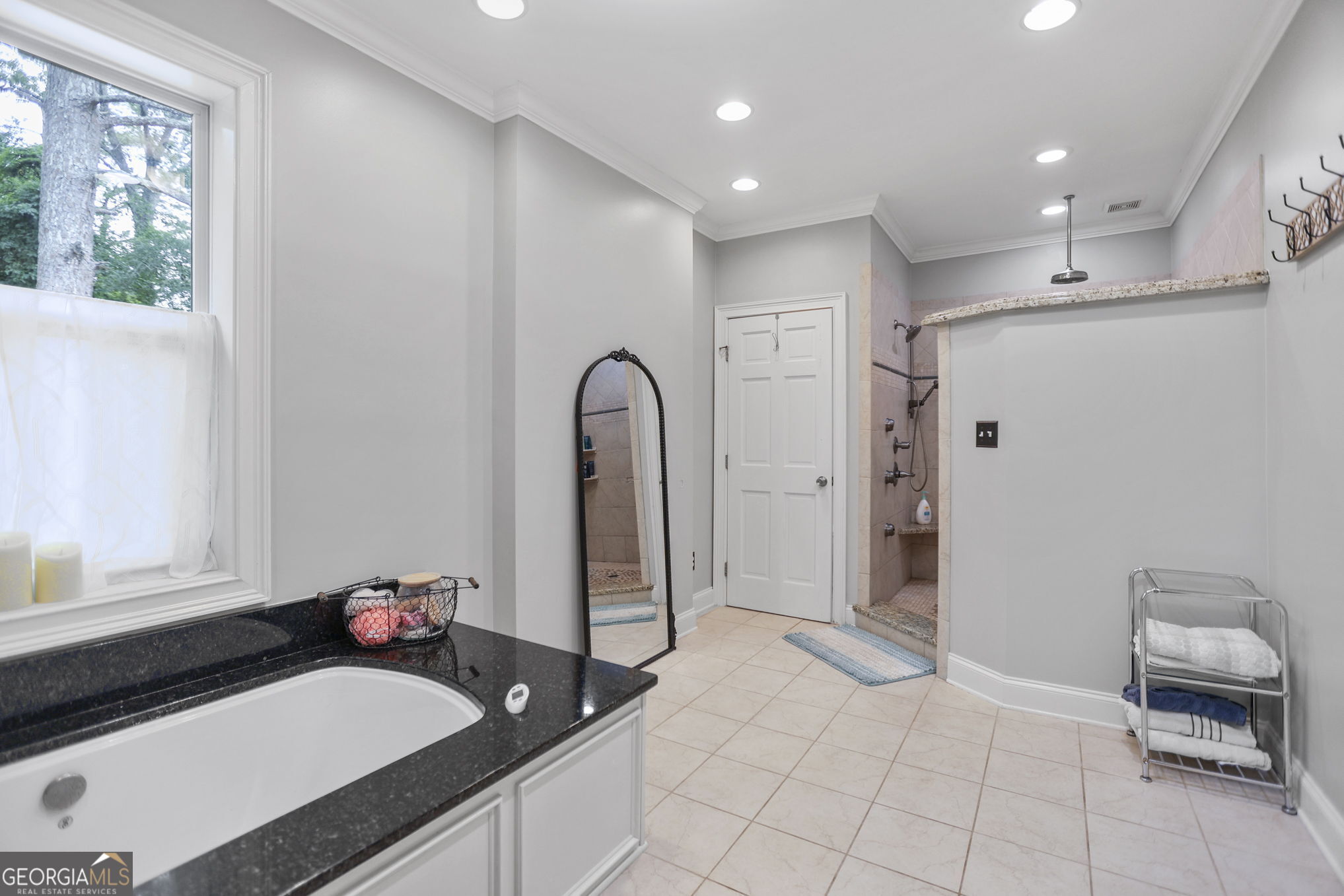 420 Ridgecrest Road LaGrange, GA 30240 - Photo 23 of 48 a bath room with a sink a mirror and a shower