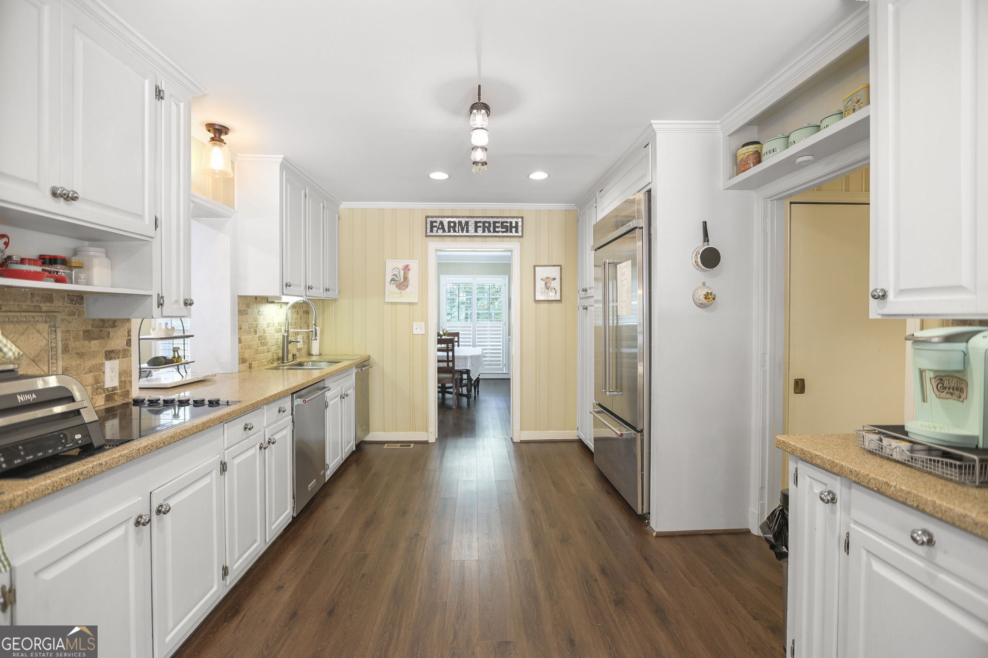 420 Ridgecrest Road LaGrange, GA 30240 - Photo 6 of 48 a large kitchen with a lot of counter space and wooden floor