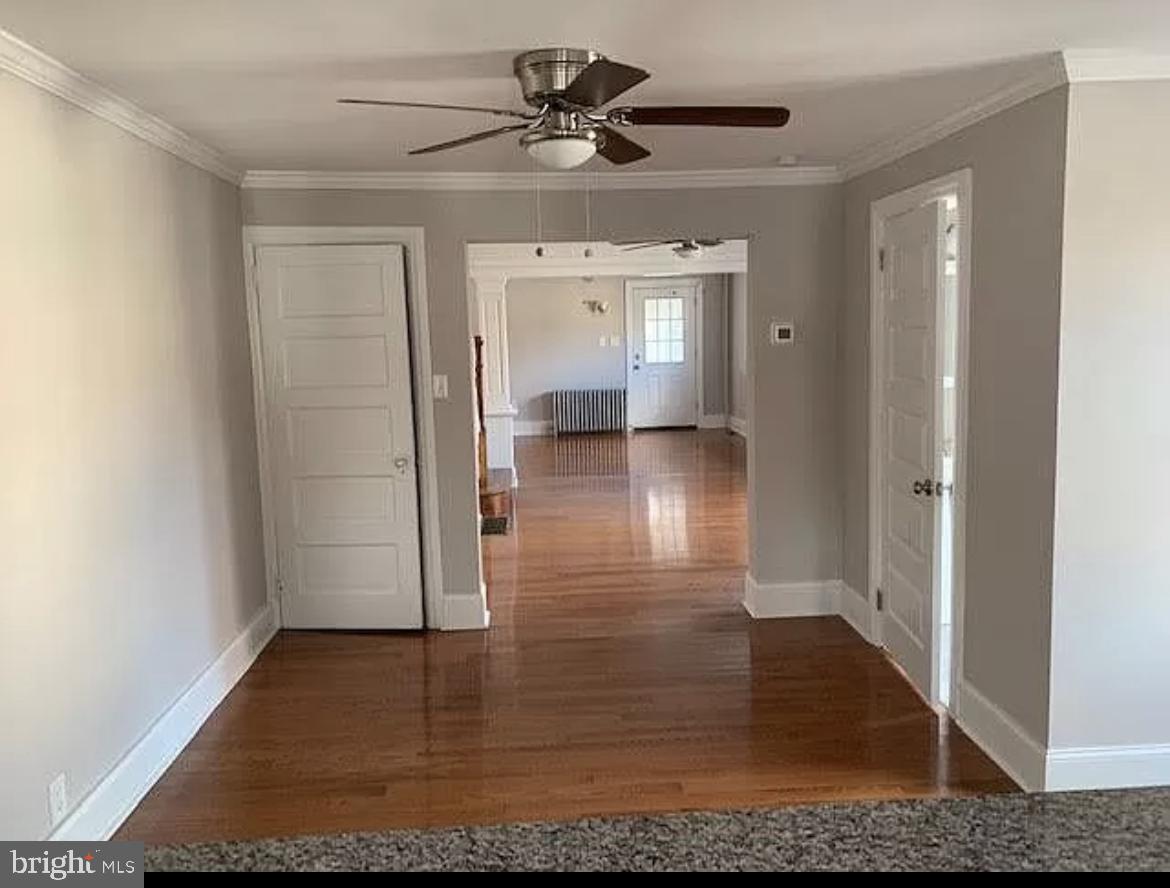 19 State Road Media, PA 19063 - Photo 4 of 18 a view of a livingroom with wooden floor and a ceiling fan