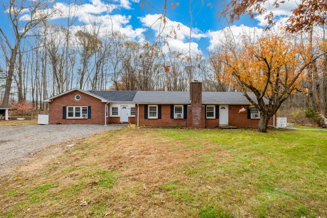 a house with trees in front of it