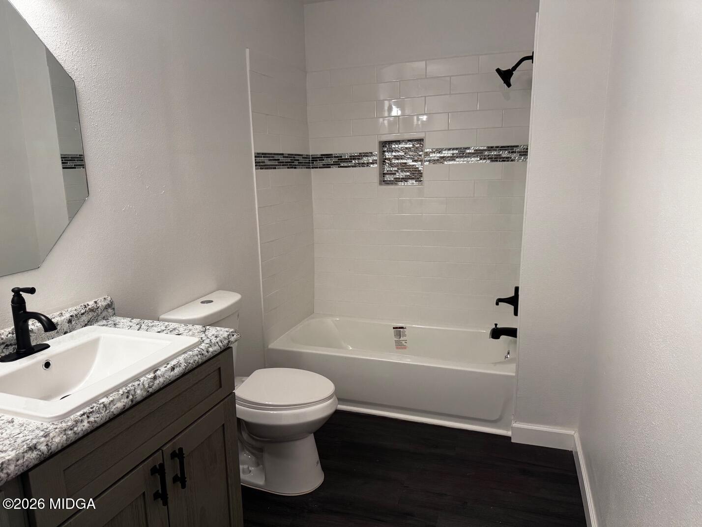 4266 Mumford Road Macon, GA 31204 - Photo 12 of 17 a bathroom with a granite countertop sink toilet and shower
