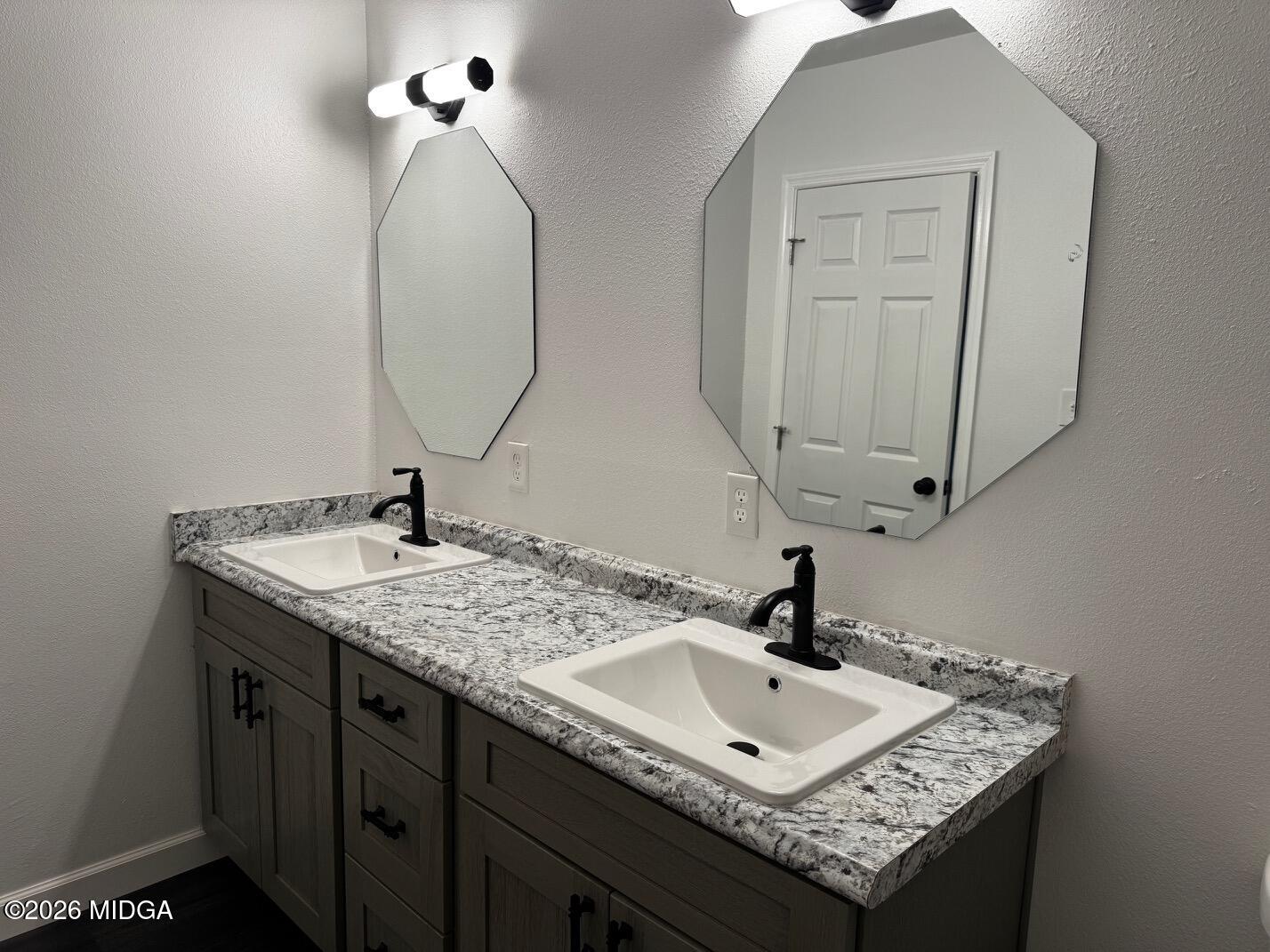 4266 Mumford Road Macon, GA 31204 - Photo 13 of 17 a bathroom with a sink and a mirror