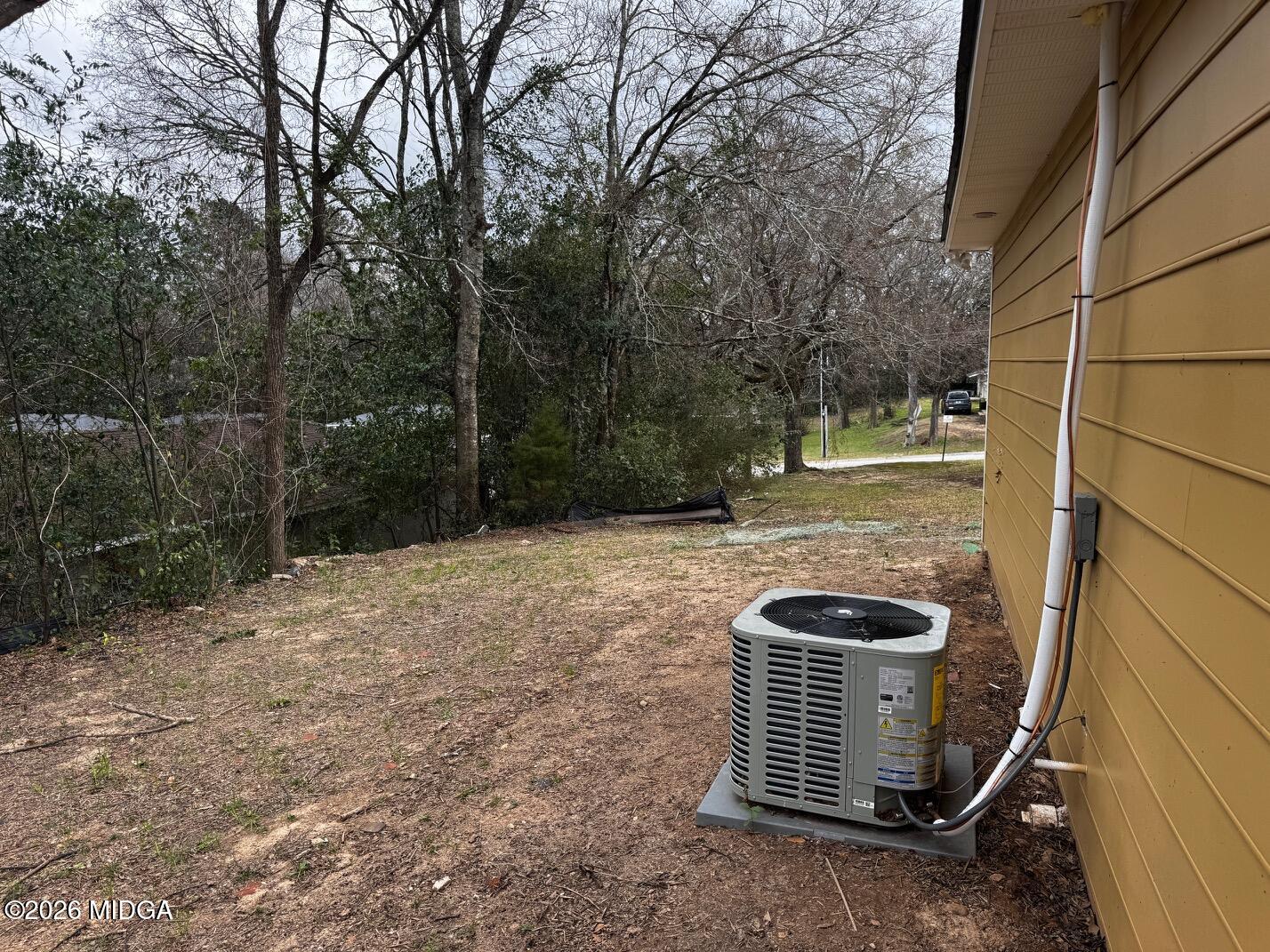 4266 Mumford Road Macon, GA 31204 - Photo 17 of 17 a backyard of a house with lots of green space