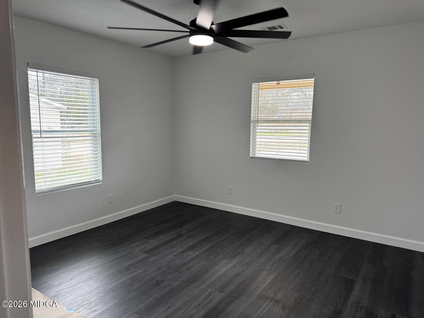 4266 Mumford Road Macon, GA 31204 - Photo 10 of 17 a view of an empty room with wooden floor and a window