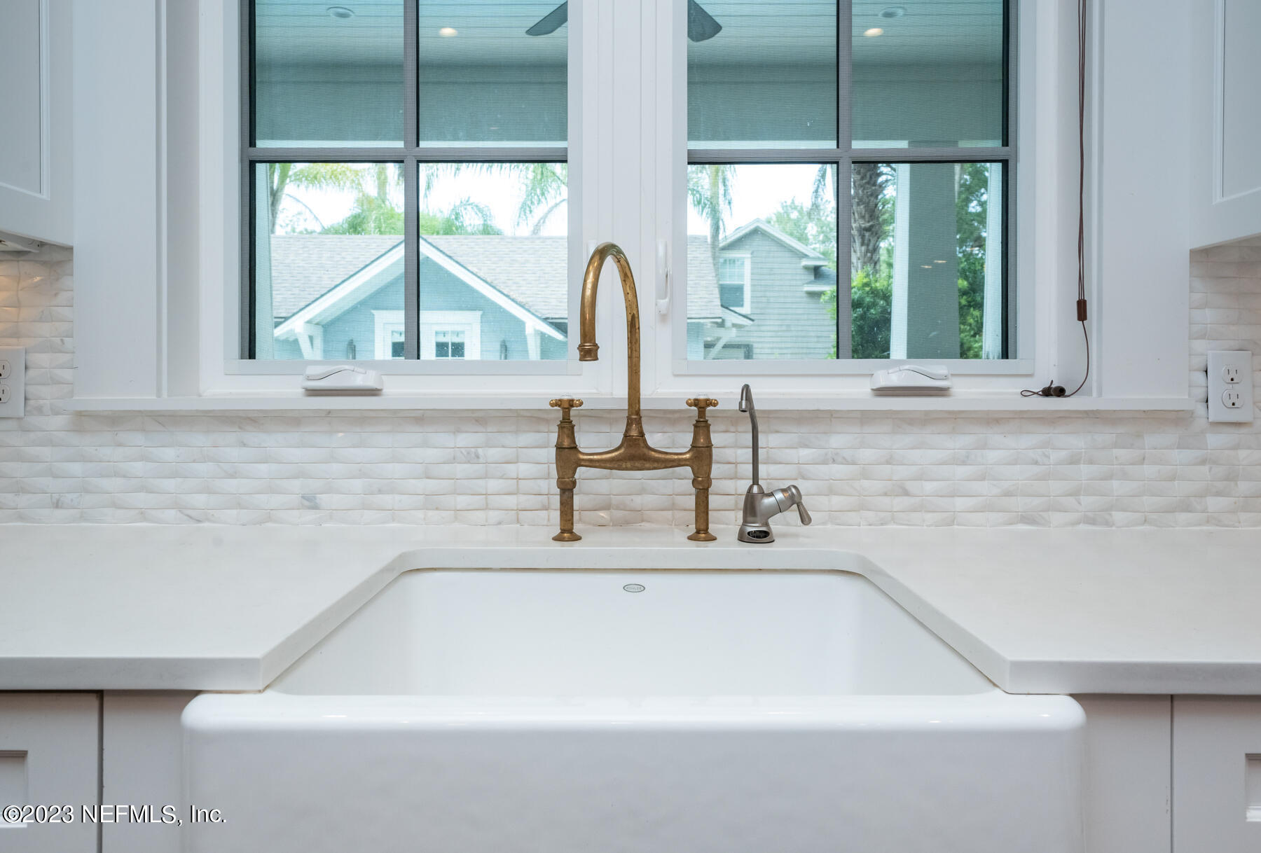 357 11th Street Atlantic Beach, FL 32233 - Photo 14 of 47 a bathroom with a sink and a window