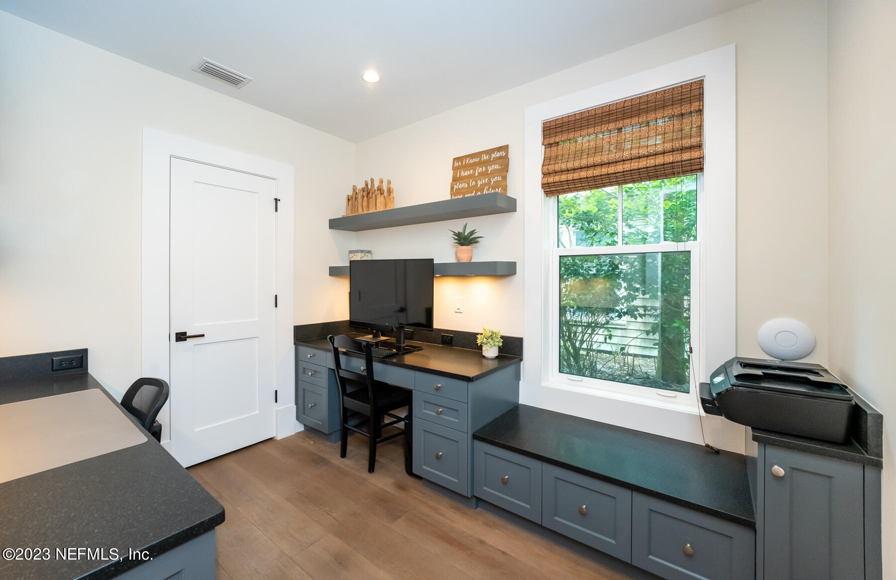 357 11th Street Atlantic Beach, FL 32233 - Photo 15 of 47 a view of a workspace with furniture and a window