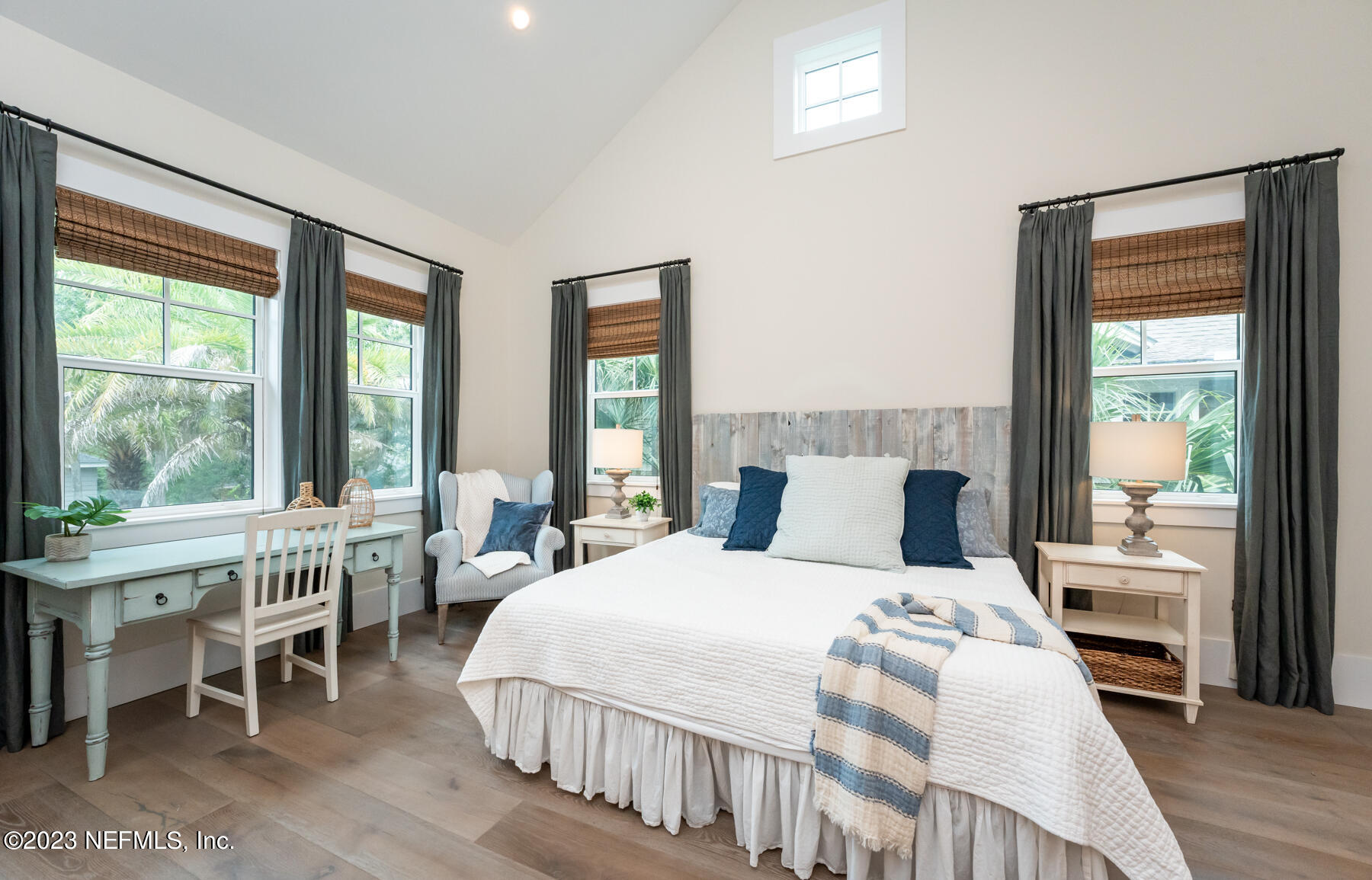 357 11th Street Atlantic Beach, FL 32233 - Photo 20 of 47 a bedroom with a bed and a large window