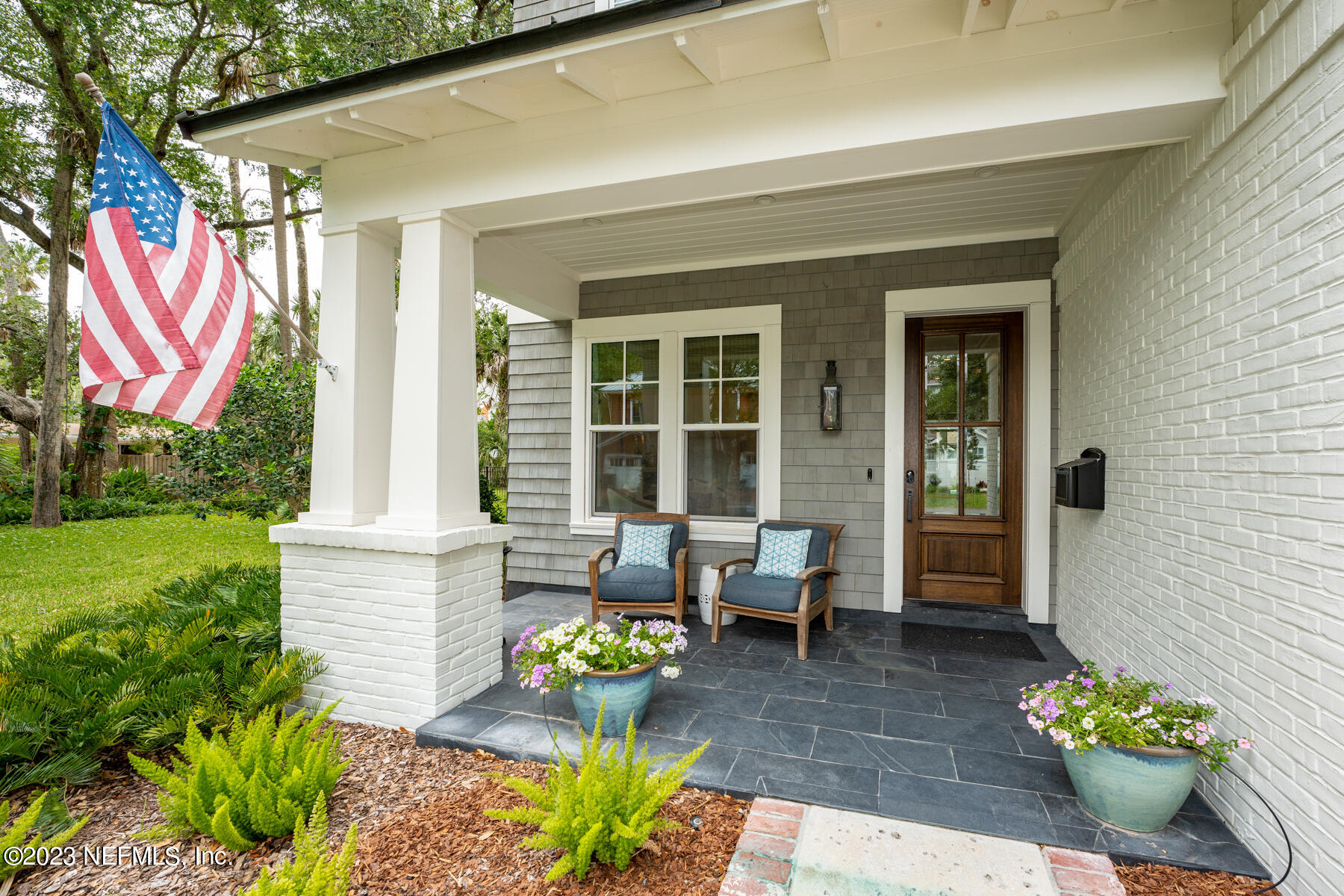 357 11th Street Atlantic Beach, FL 32233 - Photo 2 of 47 a front view of a house with outdoor seating