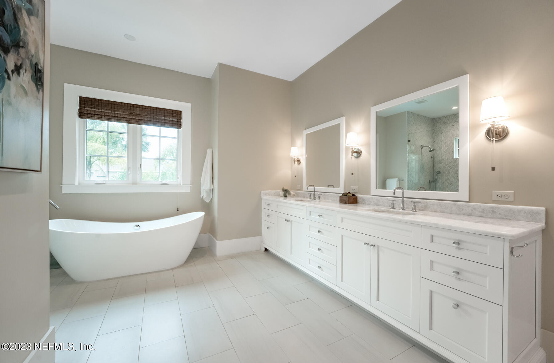 357 11th Street Atlantic Beach, FL 32233 - Photo 21 of 47 a spacious bathroom with a bathtub sink and mirror