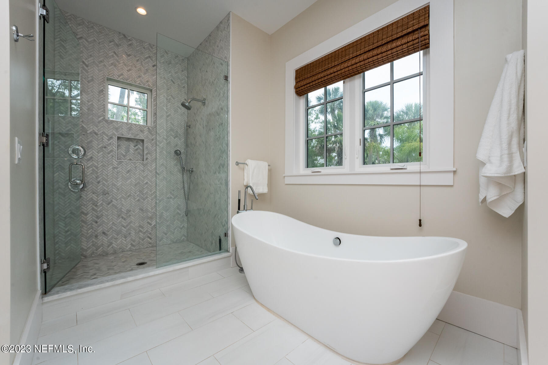 357 11th Street Atlantic Beach, FL 32233 - Photo 22 of 47 a white bath tub sitting next to a shower
