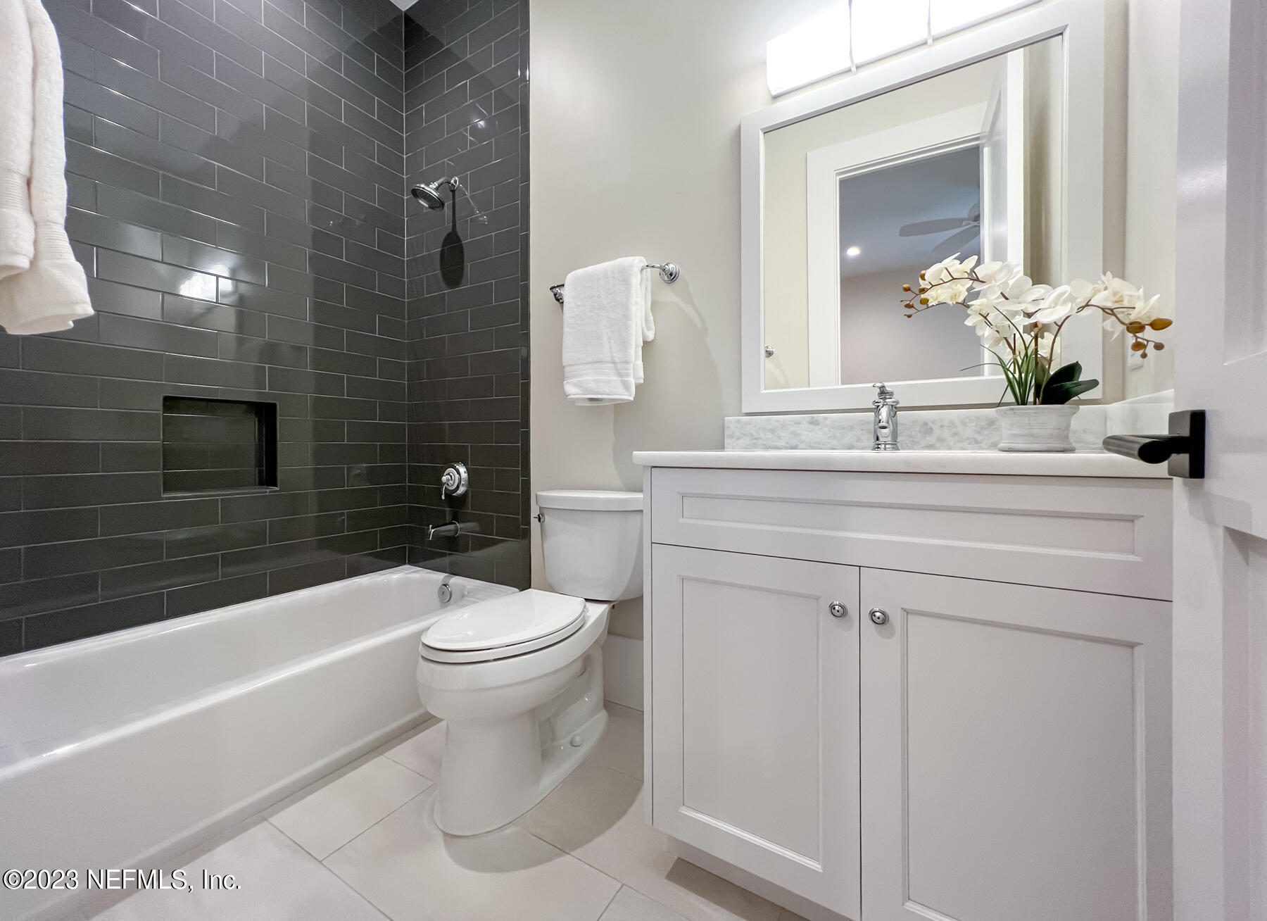 357 11th Street Atlantic Beach, FL 32233 - Photo 29 of 47 a bathroom with a sink a toilet and shower