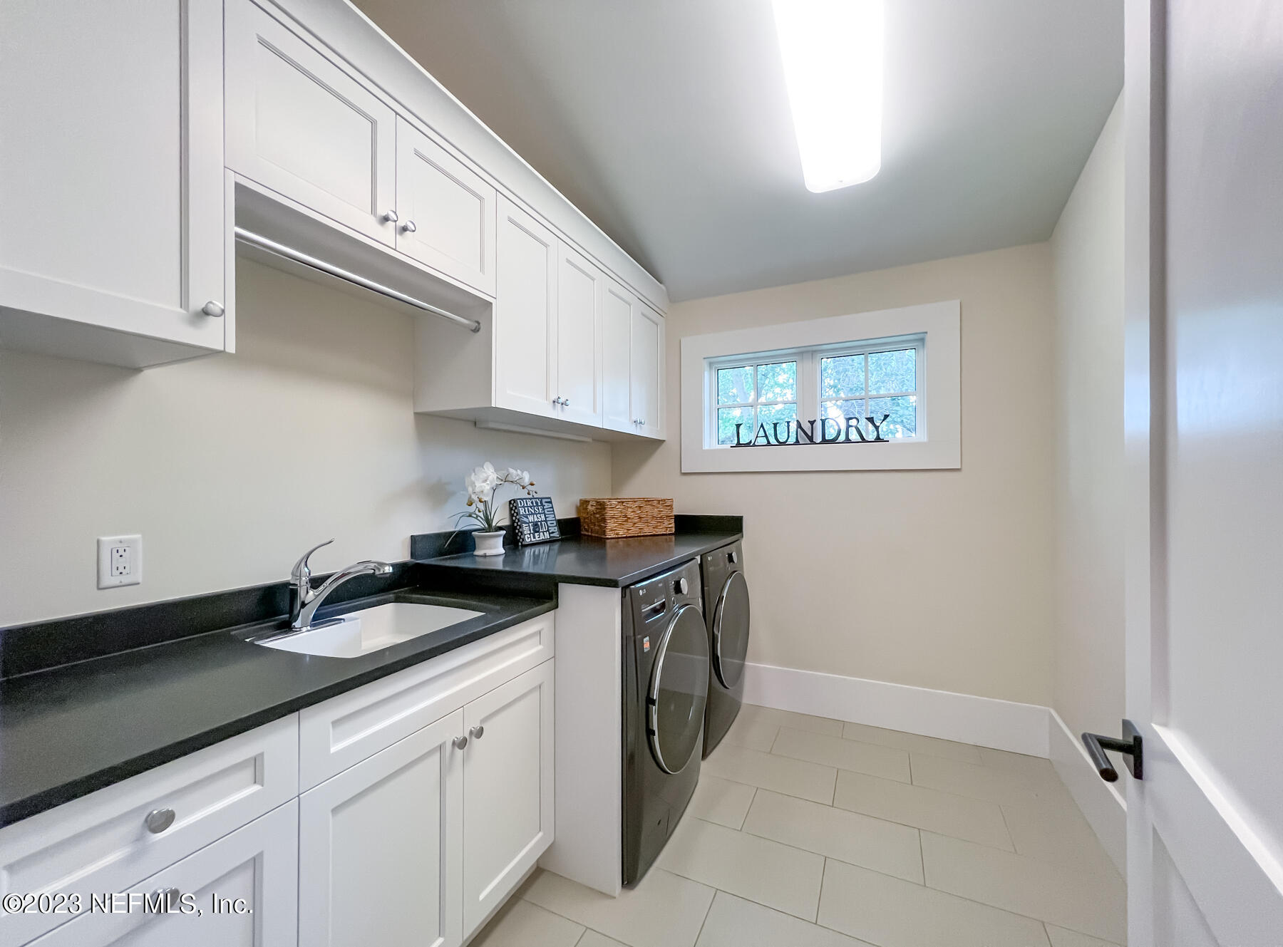 357 11th Street Atlantic Beach, FL 32233 - Photo 30 of 47 a kitchen with a sink and cabinets