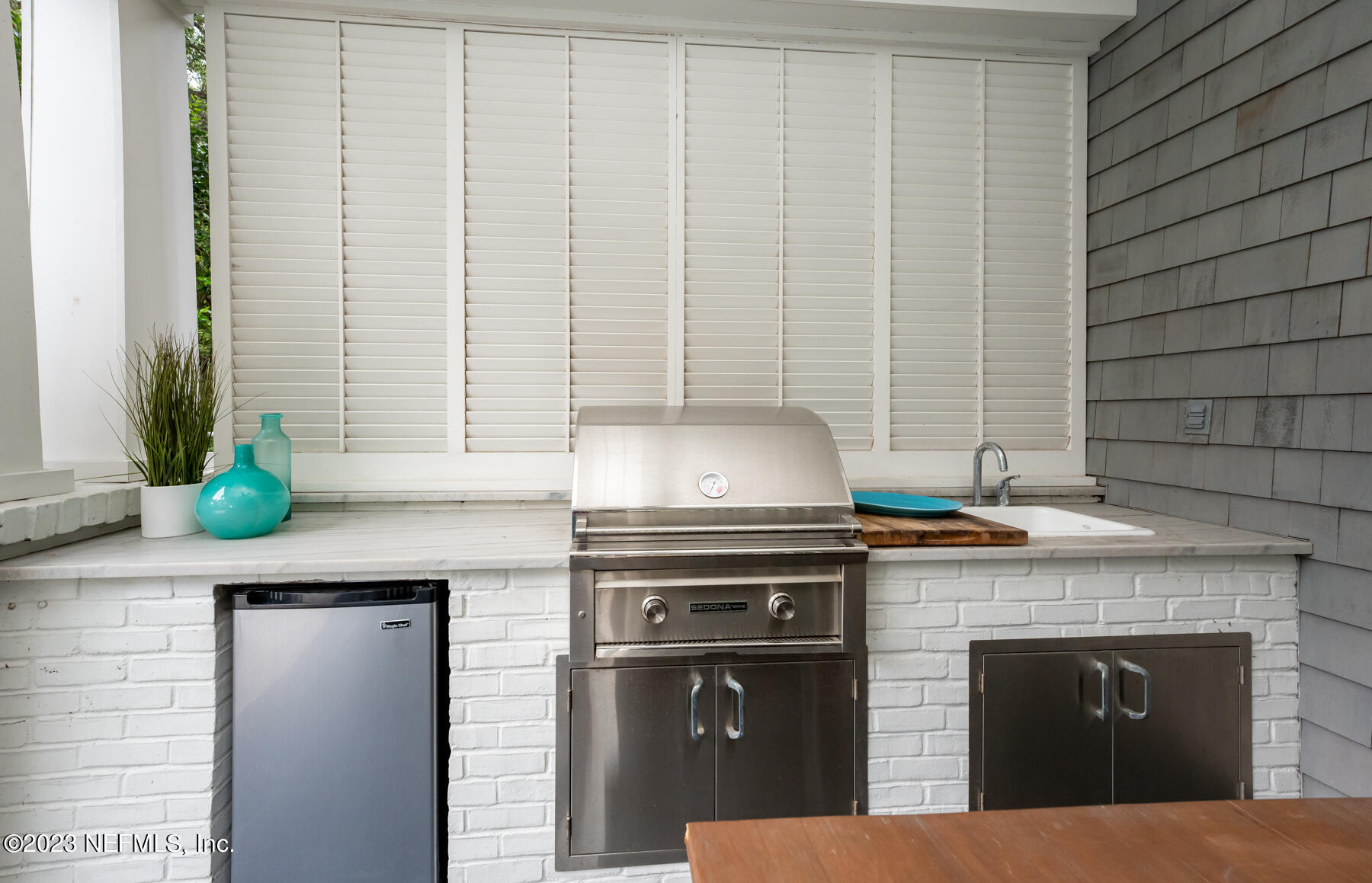 357 11th Street Atlantic Beach, FL 32233 - Photo 32 of 47 a kitchen with granite countertop a sink a stove and cabinets