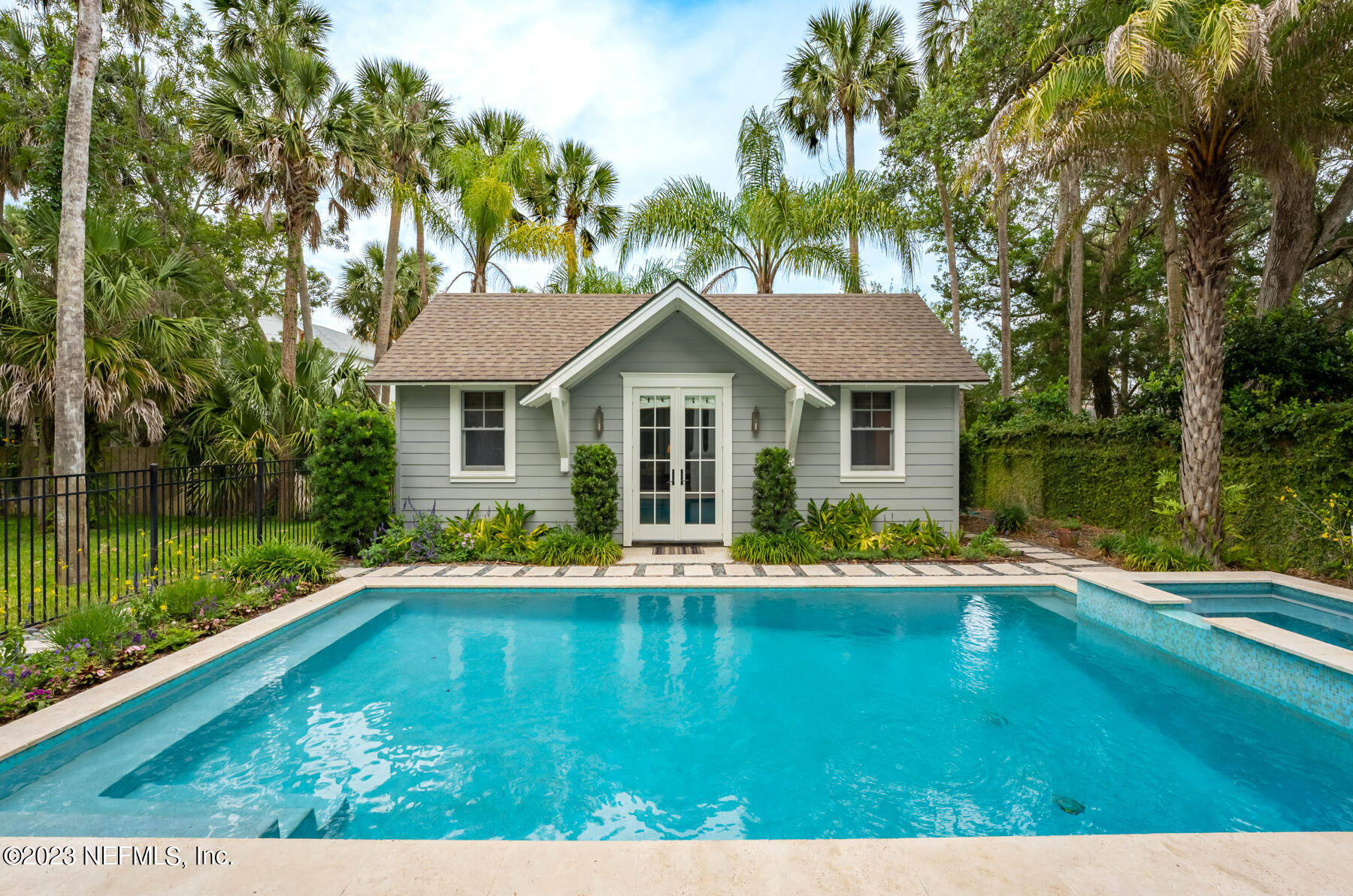 357 11th Street Atlantic Beach, FL 32233 - Photo 37 of 47 a front view of a house with a yard table and chairs