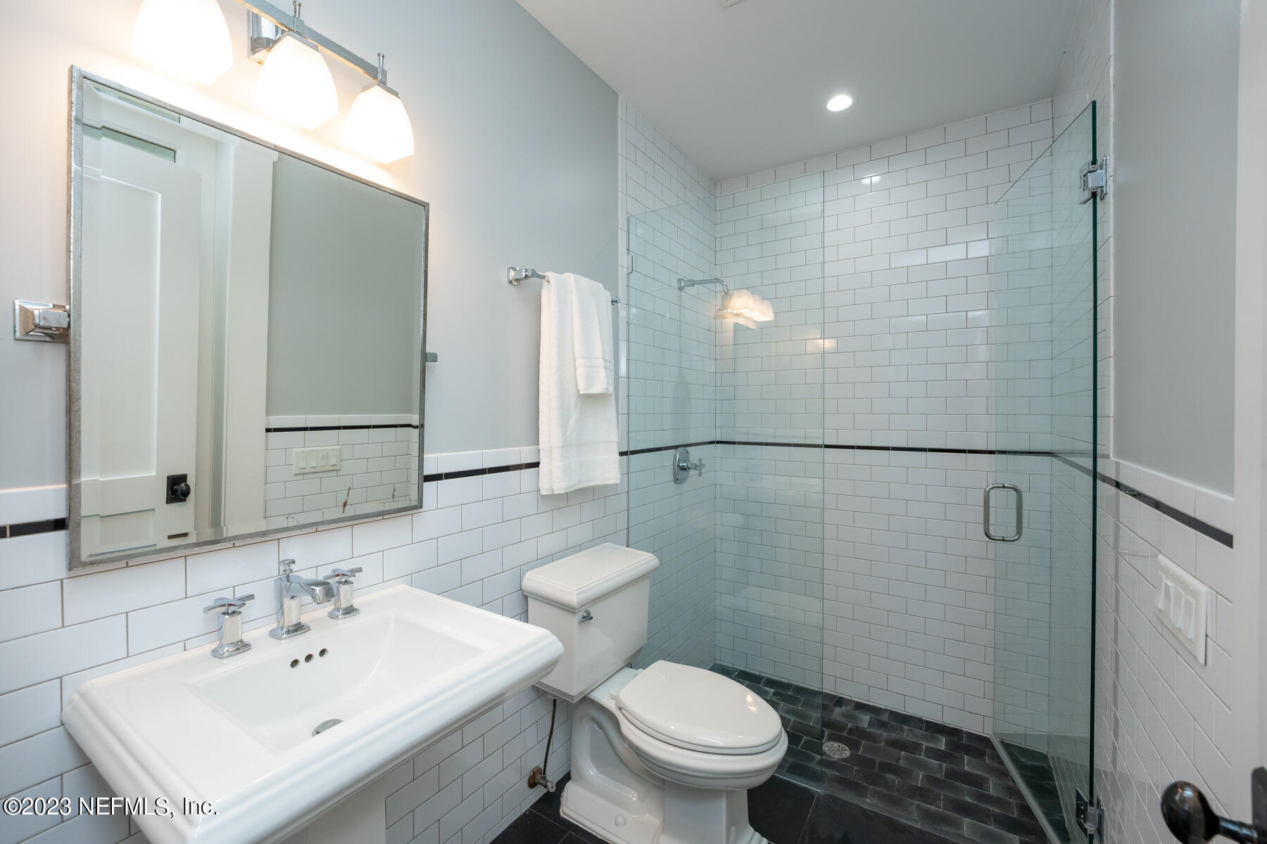 357 11th Street Atlantic Beach, FL 32233 - Photo 42 of 47 a bathroom with a sink a toilet and shower