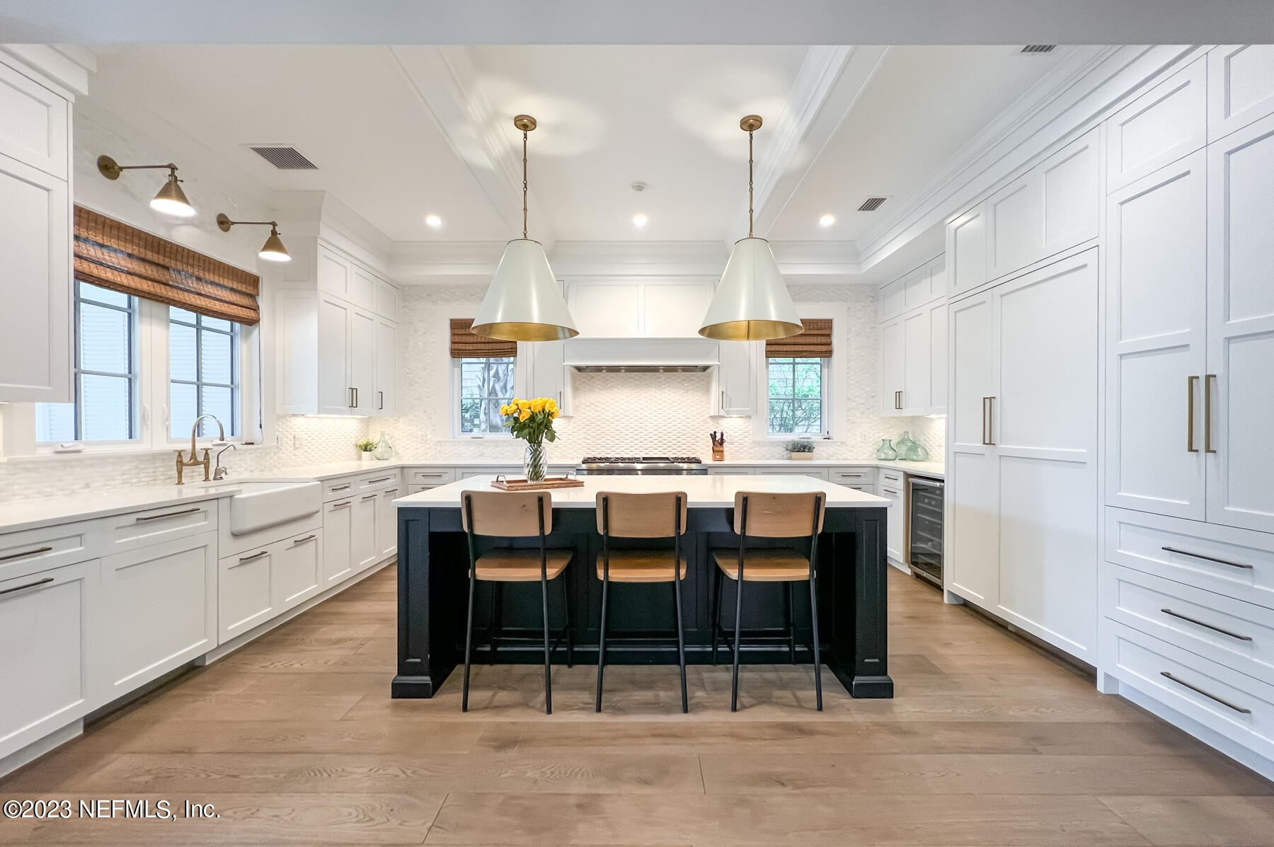 357 11th Street Atlantic Beach, FL 32233 - Photo 9 of 47 a large kitchen with a table and chairs