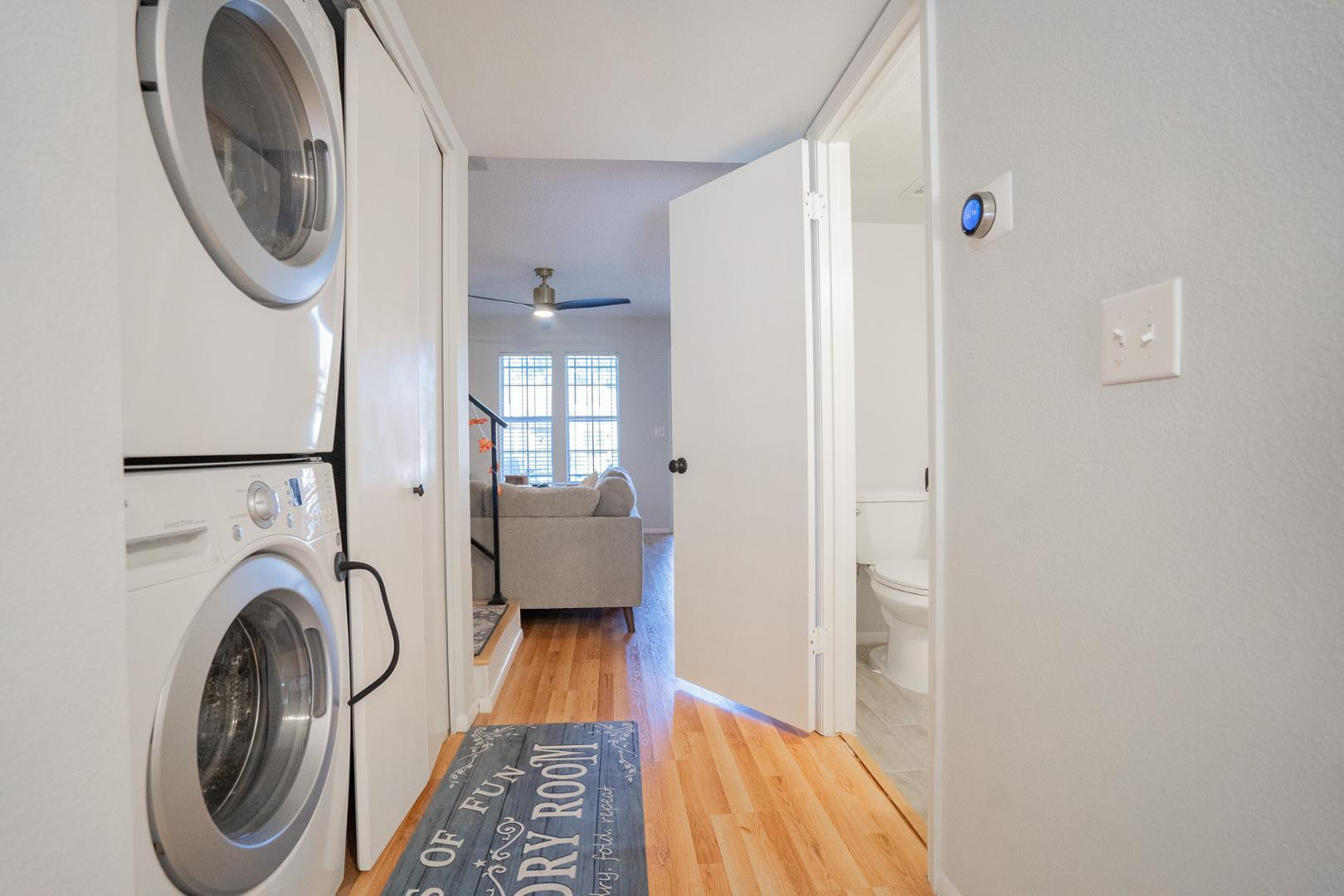 8111 West Wacker Road, Unit 70 Peoria, AZ 85381 - Photo 14 of 38 a view of a hallway with washer and dryer
