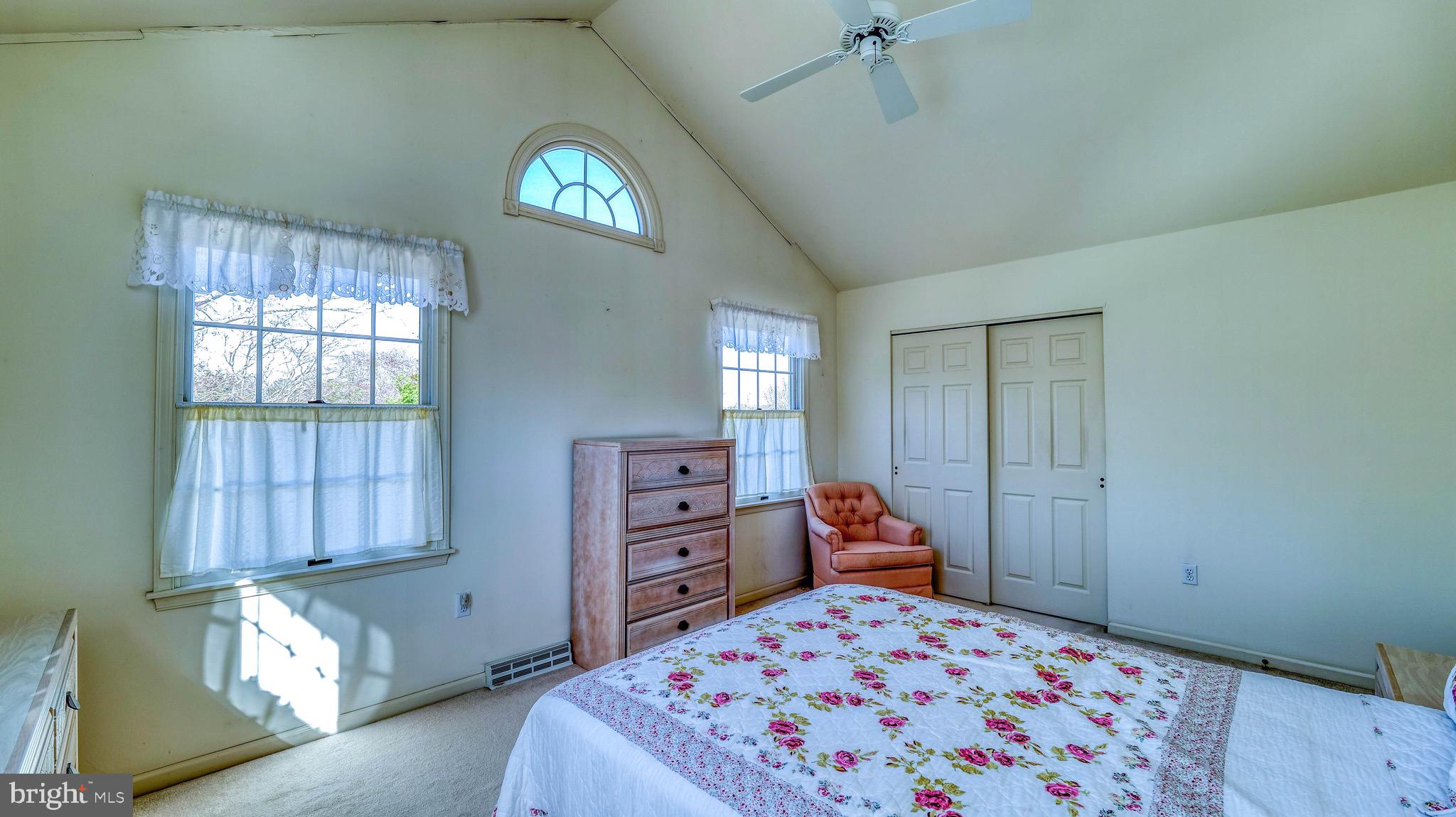 530 North Shore Road Marmora, NJ 08223 - Photo 12 of 31 a bedroom with a bed and a window