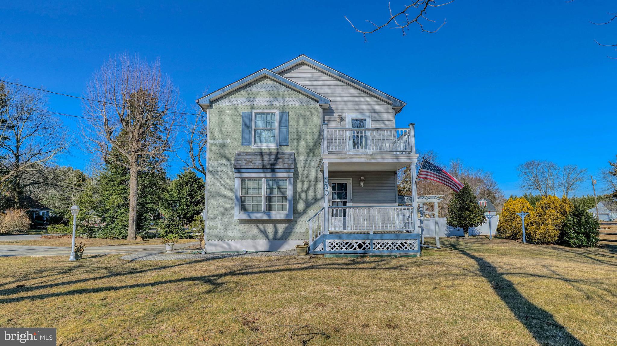 530 North Shore Road Marmora, NJ 08223 - Photo 2 of 31 a front view of a house with a yard