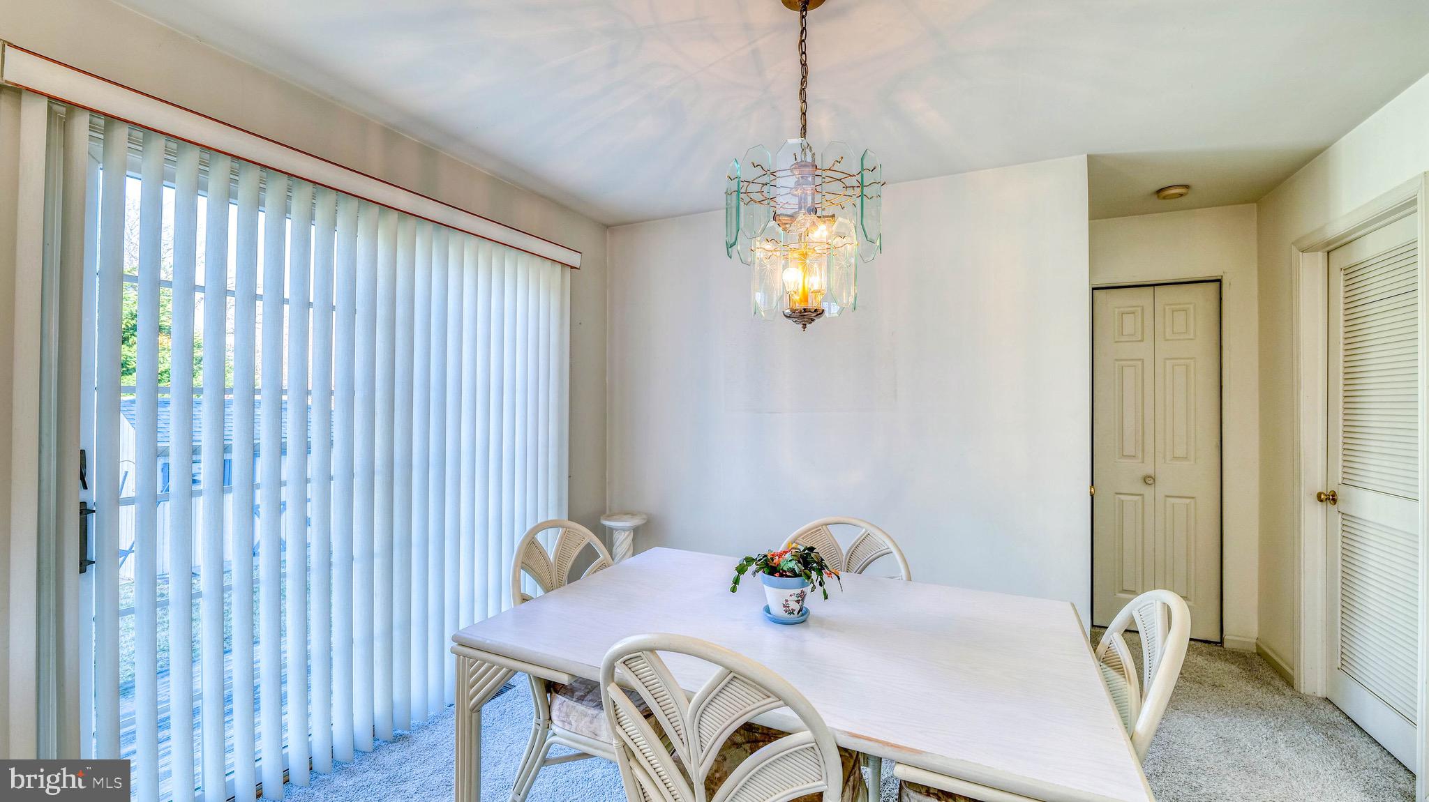 530 North Shore Road Marmora, NJ 08223 - Photo 6 of 31 a view of a dining room with furniture and a chandelier