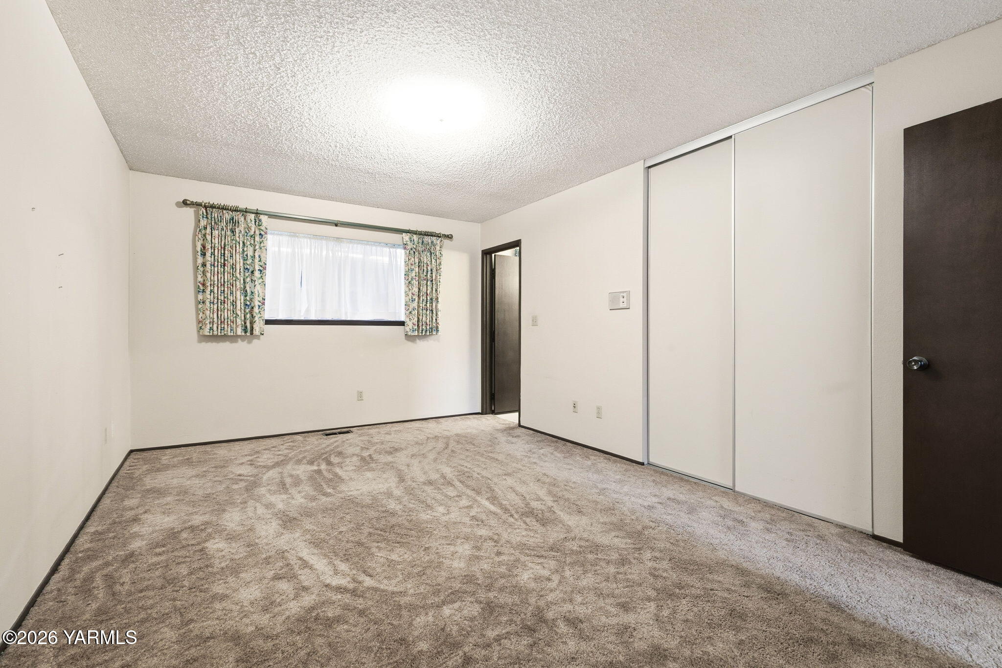 5901 Barge Street, Unit 43 Yakima, WA 98908 - Photo 14 of 22 a view of an empty room with a window