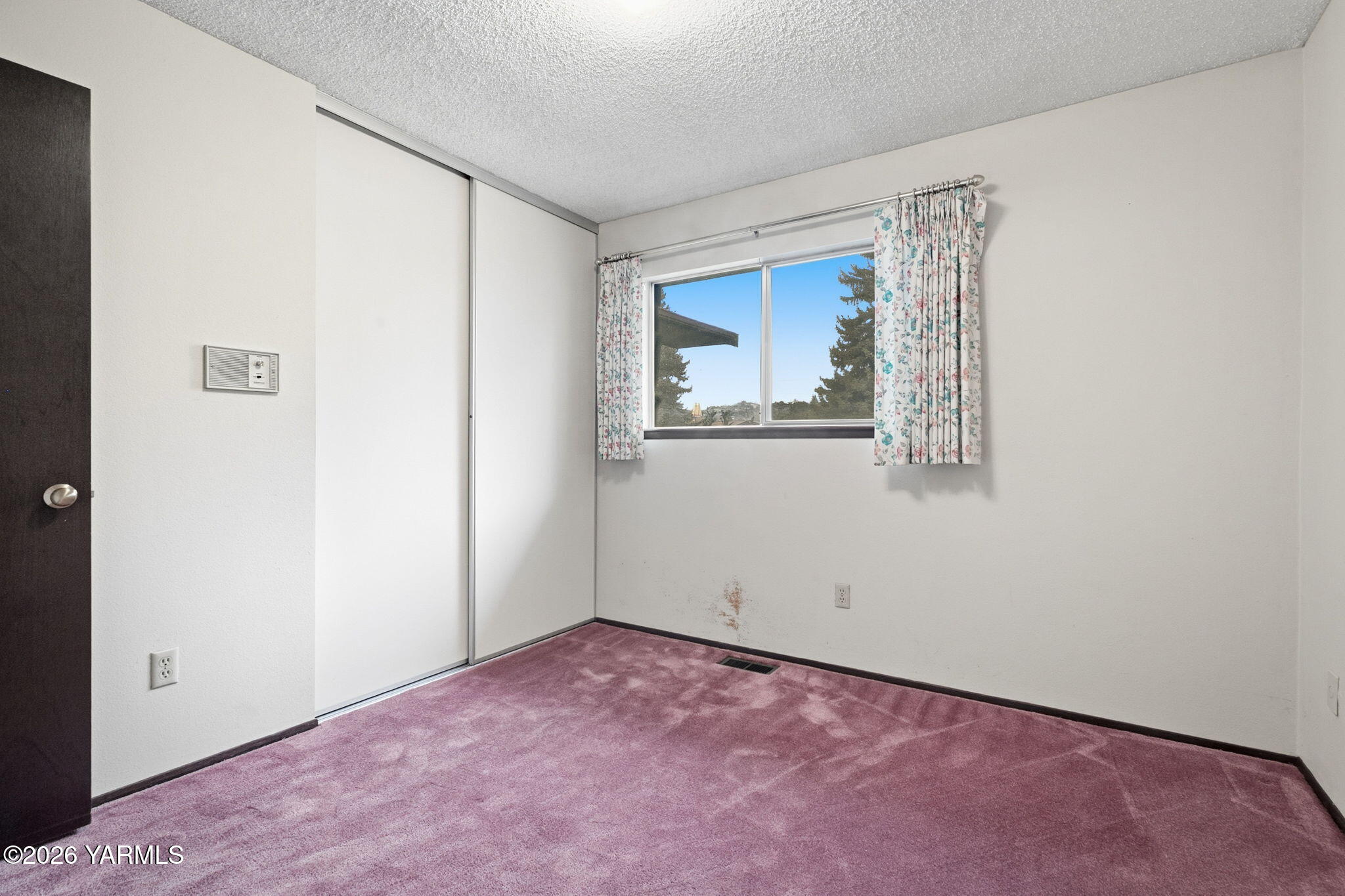 5901 Barge Street, Unit 43 Yakima, WA 98908 - Photo 16 of 22 an empty room with windows