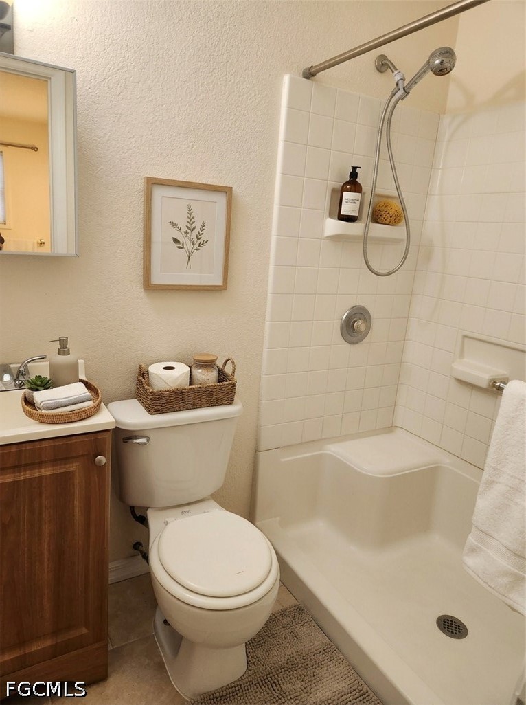 3417 19th Street Southwest Lehigh Acres, FL 33976 - Photo 11 of 14 a bathroom with a sink a toilet and shower