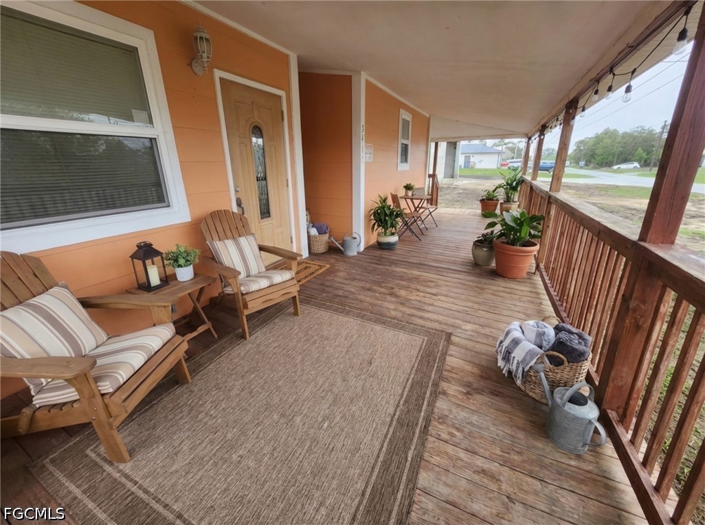 3417 19th Street Southwest Lehigh Acres, FL 33976 - Photo 13 of 14 a living room with furniture and a large window