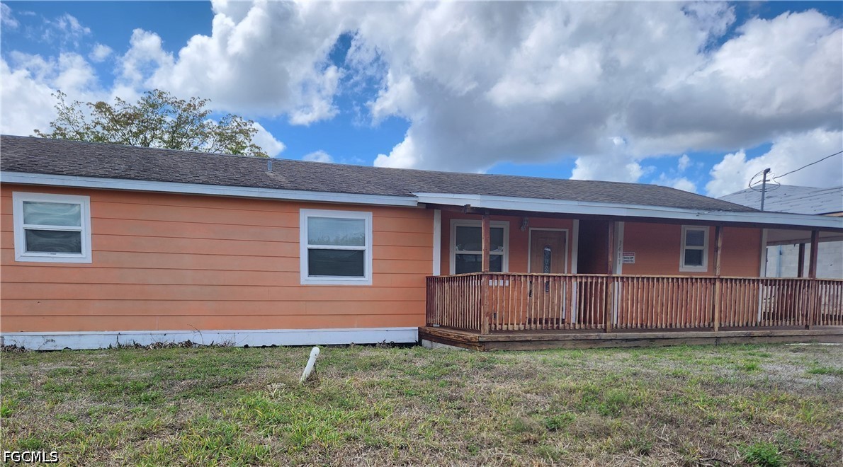 3417 19th Street Southwest Lehigh Acres, FL 33976 - Photo 14 of 14 a house view with a backyard space
