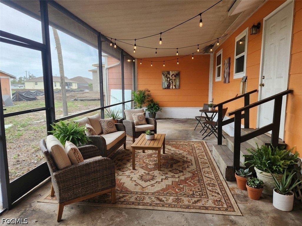 3417 19th Street Southwest Lehigh Acres, FL 33976 - Photo 4 of 14 a living room with furniture wooden floor and a potted plant
