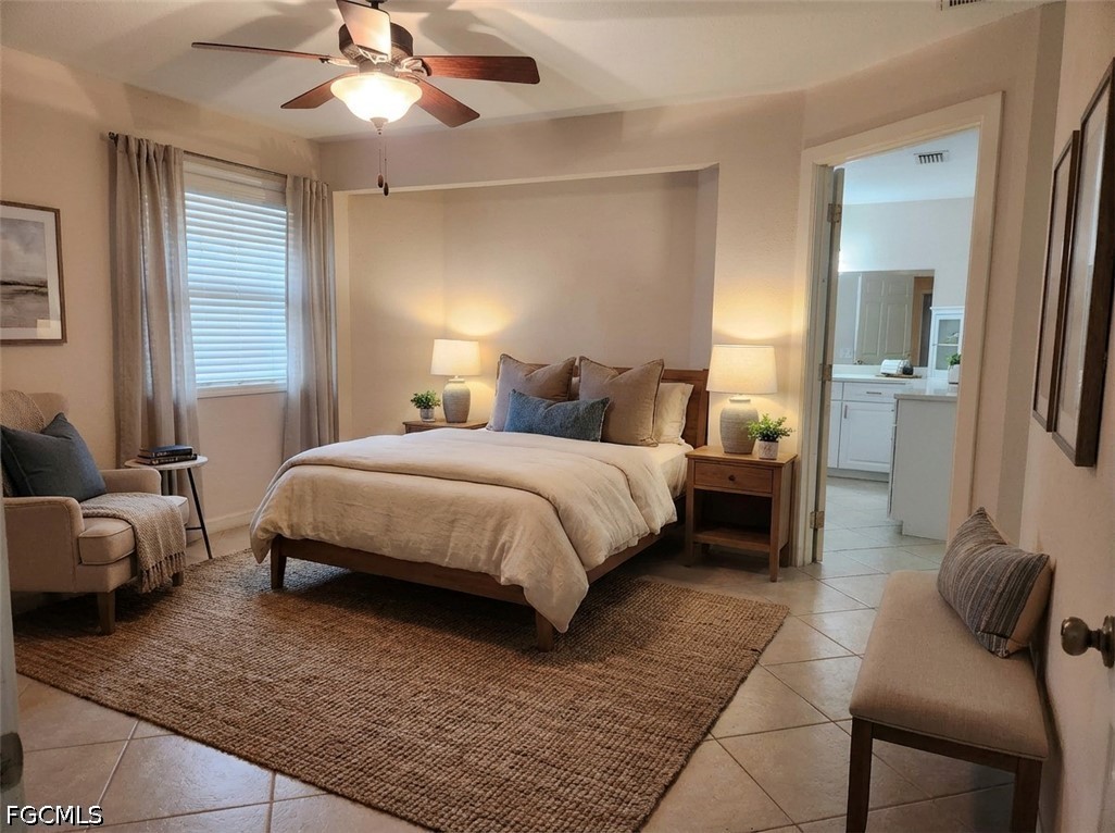 3417 19th Street Southwest Lehigh Acres, FL 33976 - Photo 6 of 14 a bedroom with a bed and furniture